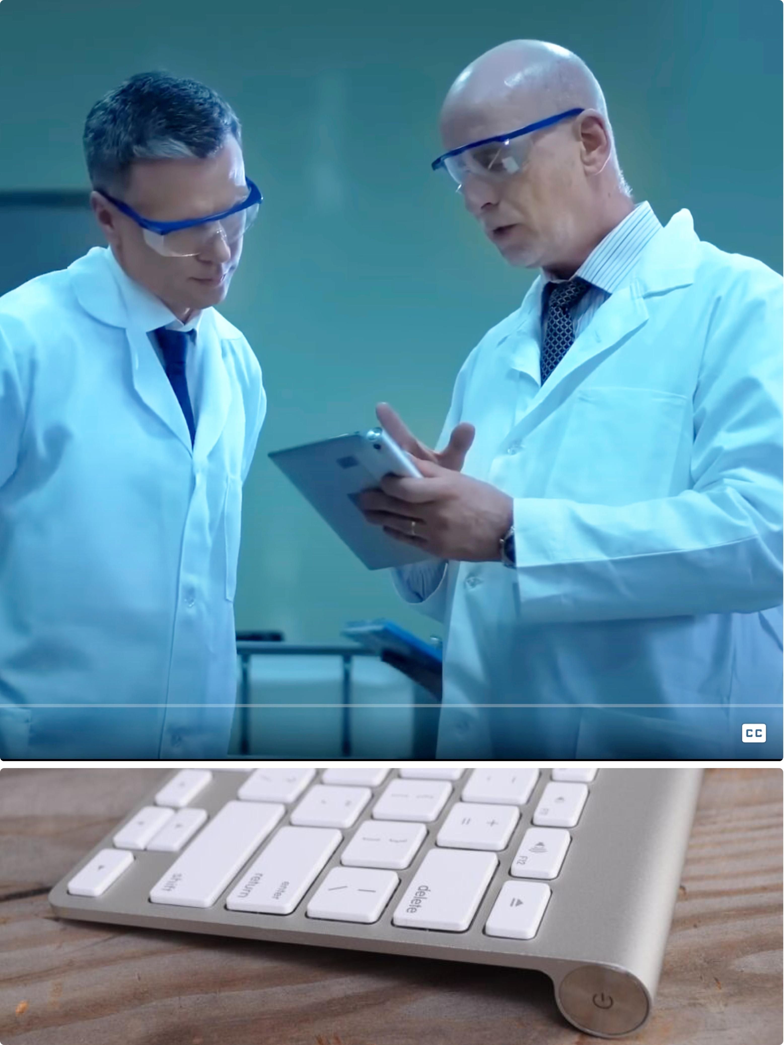 I'm like 80% sure the scientists in this stock footage are consulting a wireless keyboard turned sideways.