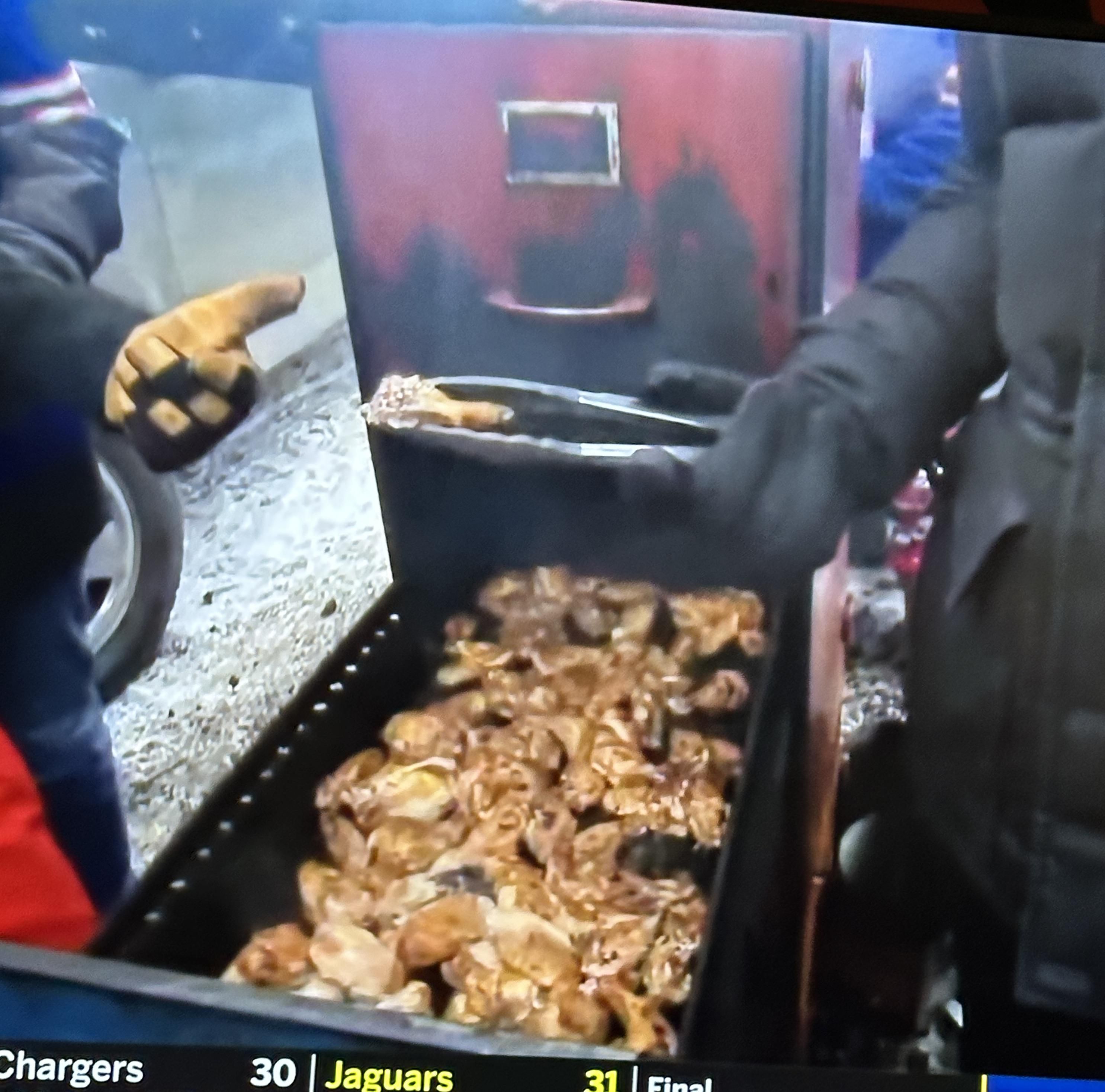 Watching Bills fans cooking meat… in a filing cabinet.