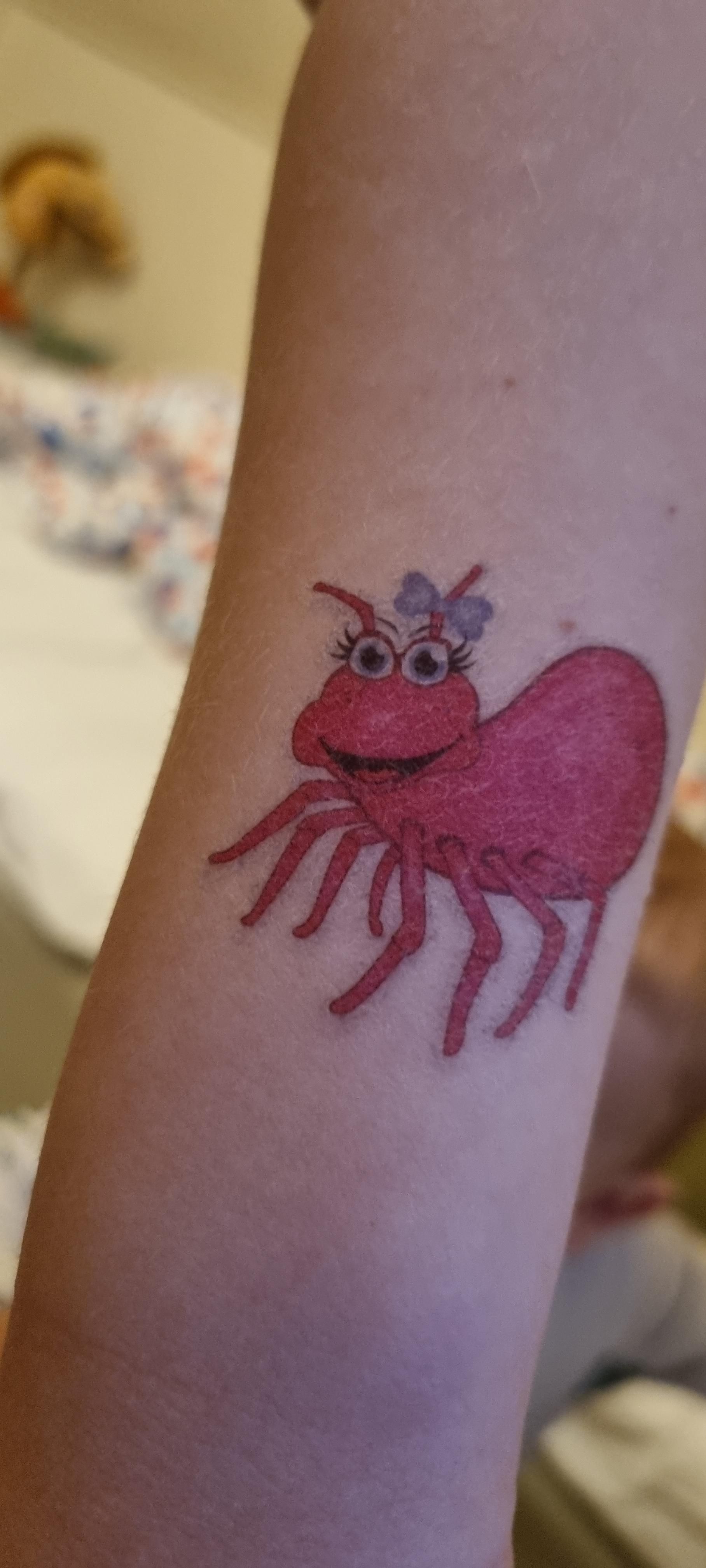 Out of hundreds of fake tattoos my daughter could have chosen after the dentist visit, she chose a tick...