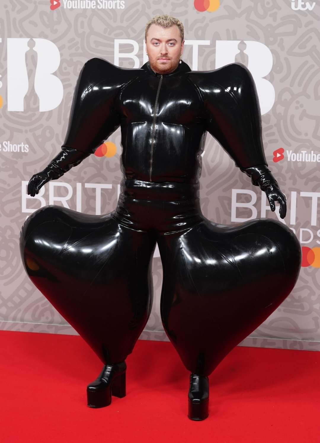 Sam Smith posing at the Brit Awards