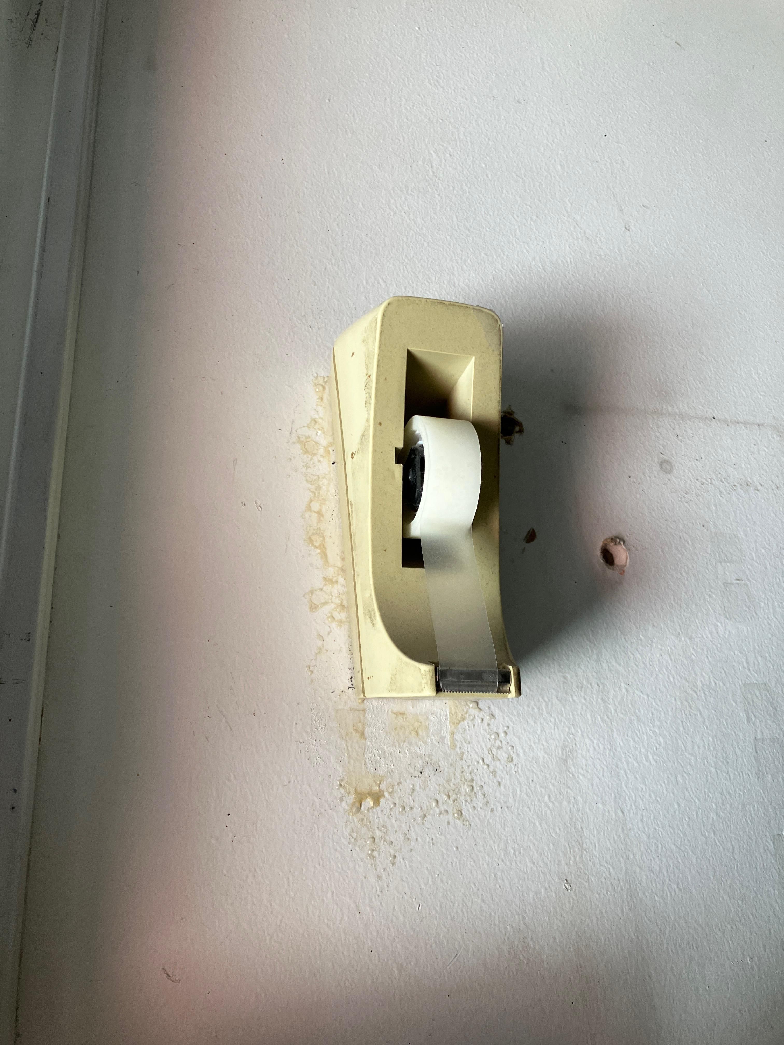 Someone stole the tape dispenser from my desk at work and glued it to the wall in our electrical panel room. I don’t know why.