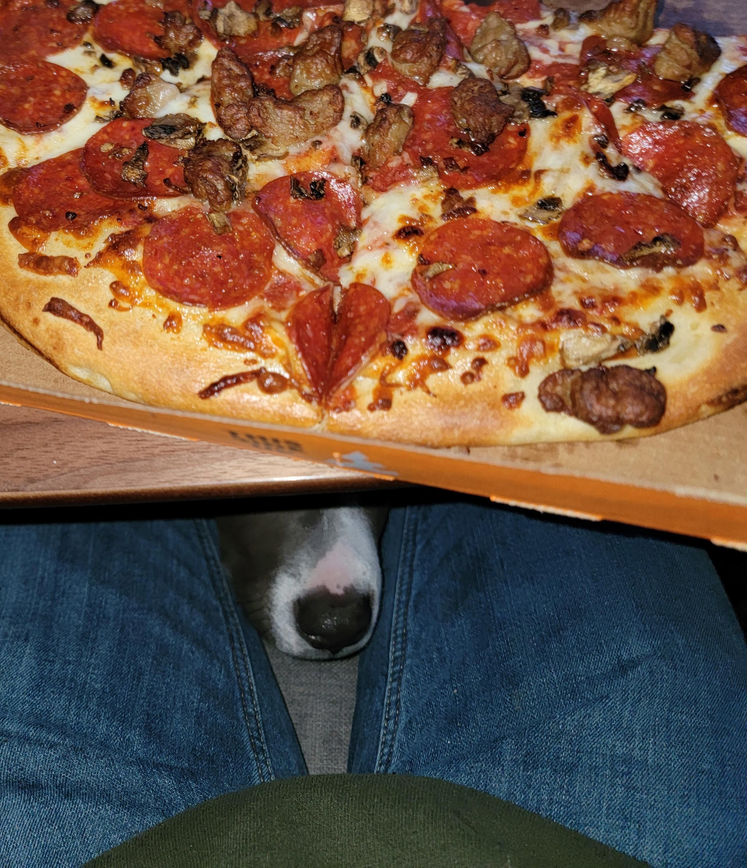 Waiting on that one piece of stray sausage to fall off a slice.