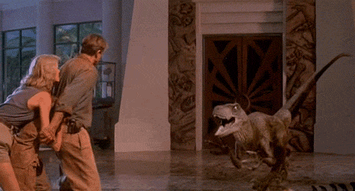 Notice how the guy just gave up defending himself as soon as the raptor jumped