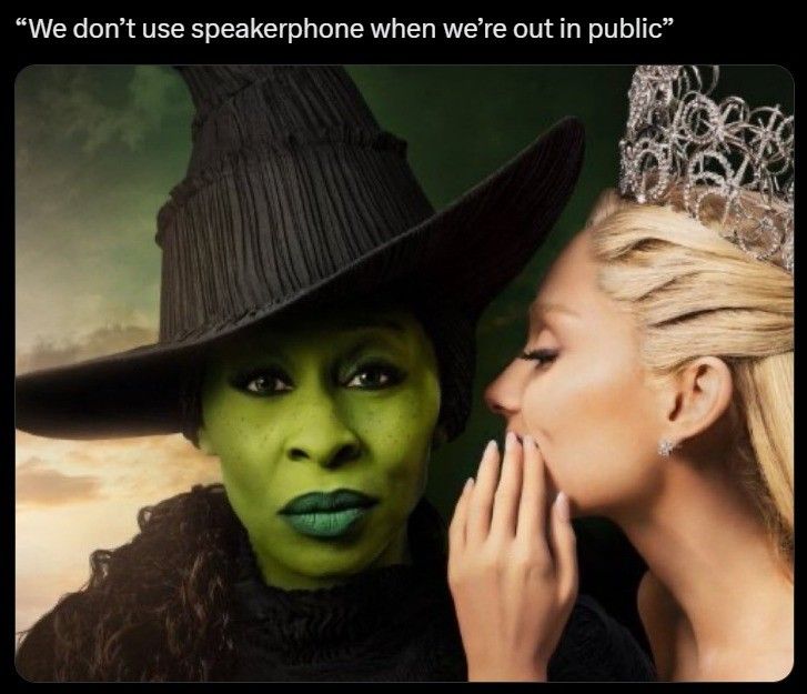 I don't see a green witch, I see a black woman with green paint on her face